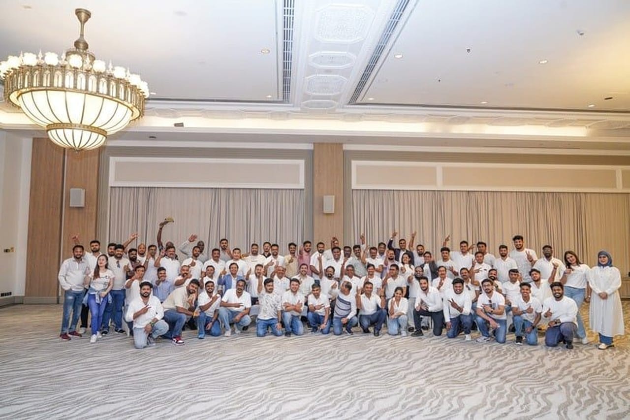 Large enterprise corporate team celebrating together at a Thriveus event in Dubai